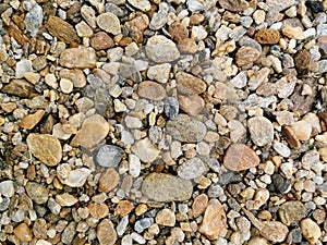 Top view of Pebbles texture background. River stones landscape