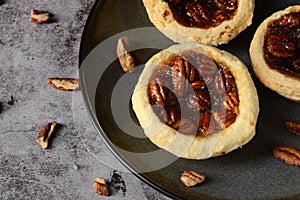 Top view pecan butter tarts with nuts