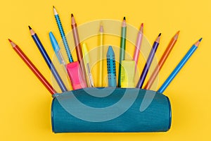 Top view of pencil case with school supplies