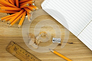 Top-view of pencils and lined paper