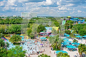 Top view of people enjoying beaches , pools and water attractions at Aquatica and Hilton Hotel in International Drive area.