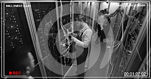 Top view, people work in the data center in the server room