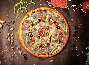 Top view of pepperoni cheese pizza with sliced green bell pepper, black olives and mushrooms