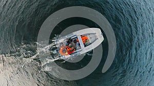 Top view of a person swimming in a dinghy