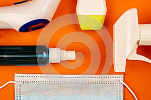 Top view of pharmaceutical products and equipment on orange background