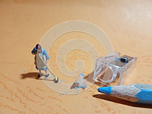 Top View Photo 1 woman cleaning trash from pencil sharpener with negative space