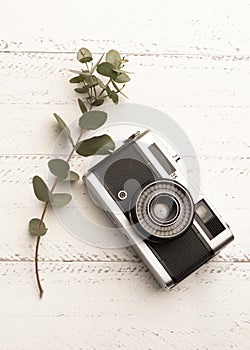 Top view photo camera wooden table. High quality and resolution beautiful photo concept