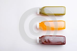 Top view photo of different detox juice bottles, antioxidant and daily vitamins you need
