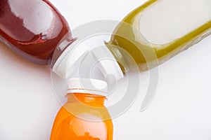 Top view photo of different detox juice bottles, antioxidant and daily vitamins you need