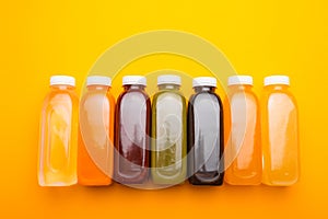 Top view photo of different detox juice bottles, antioxidant and daily vitamins you need