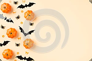 Top view photo of halloween decorations small pumpkins web in the corners spiders cats pumpkins and bats silhouettes on isolated