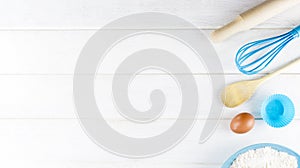 Top view photo with Kitchen Utensils on white vintage, natural, wooden background. Space for text