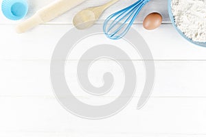 Top view photo with Kitchen Utensils on white vintage, natural, wooden background. Space for text