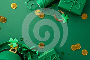 Top view photo of leprechaun cap gift boxes spool of twine gold coins bow-tie horseshoe trefoils and confetti