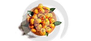 top view photo of a pile of oranges on a plate