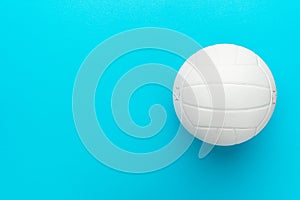 Top view photo of volleyball ball over turquoise blue background