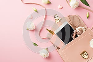 Top view photo of woman`s day composition open pink leather bag with smartphone scrunchies glasses pen small hearts and prairie