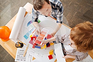 Top view photo of the workplace where spending time dad and son