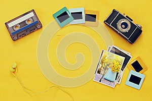 Top view of photographs next to old camera