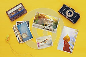 Top view of photographs next to old camera