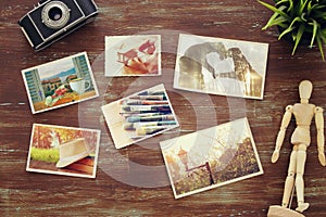 top view of photos collage on wooden background