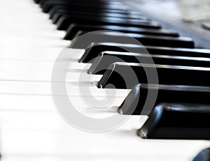 Top view of piano keys. Close-up of piano keys. Close frontal view. Piano keyboard with selective focus. Diagonal view. Piano