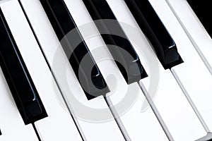 Top view of piano keys. Close-up of piano keys. Close frontal view. Piano keyboard with selective focus. Diagonal view. Piano keyb