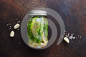 Top view of pickled asparagus in a jar