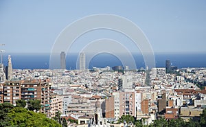 Panoramic view of Barcelona from Park Guell in a summer day in Spain. Top view of picturesque Barcelona cityscape in