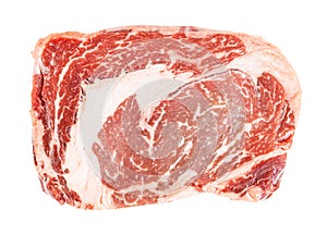 Top view of piece of raw ribeye steak isolated