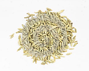 Top view of pile of anise seeds close up on gray