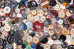 Top view of pile of many different buttons