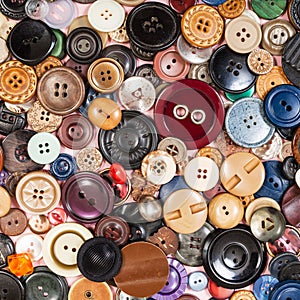 Top view of pile of many various buttons