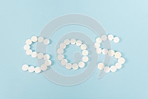 Top view of pills with sos