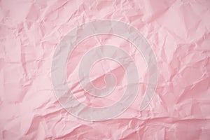 Top view of  pink crumpled paper background