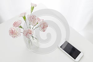 Top view of pink and white carnation flowers vase
