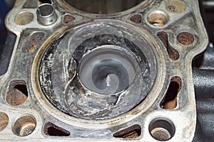 Top view of the piston installed in the cylinder block of a diesel engine
