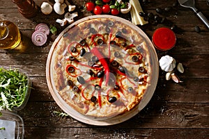 Top view pizza with fresh red pepper and ingredients on table