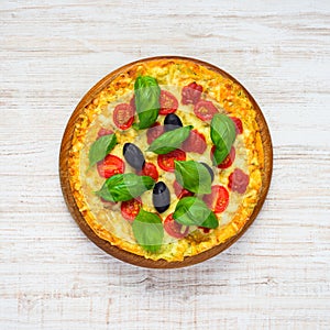 Top View of Pizza with Tomato and Basil