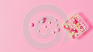 top view of plastic case with various pills