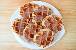 Top View of a Plate of Belgian Waffles on Wooden Table