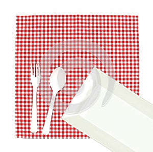 Top view plate with fork and spoon on tablecloth for food serving background