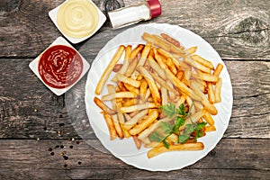 Top view on plate with french fries
