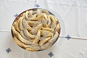 Plate of fresh baked Kaab El Ghazal, a moroccan sweet also known as gazzele horns due to his peculiar shape made mainly with almon photo