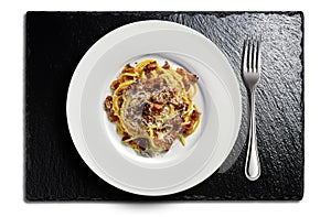 Top view of Plate with spaghetti carbonara on black stone