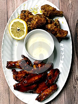 Top view of plated Lemon Pepper and Honey BBQ Chicken Wings