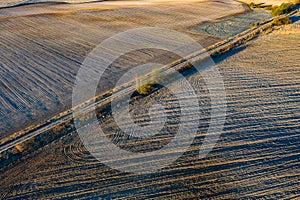 Top view of the plowed land. Agriculture and landscape. Aero