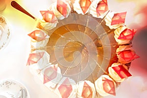 Top view on a plum-cream-cake with decoration of bright chocolate rhombuses