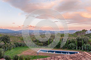 Top view of the pool and landscape. Enjoying the sunset from  a country house