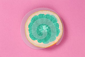 Top view popart grapefruit green color on a pink background